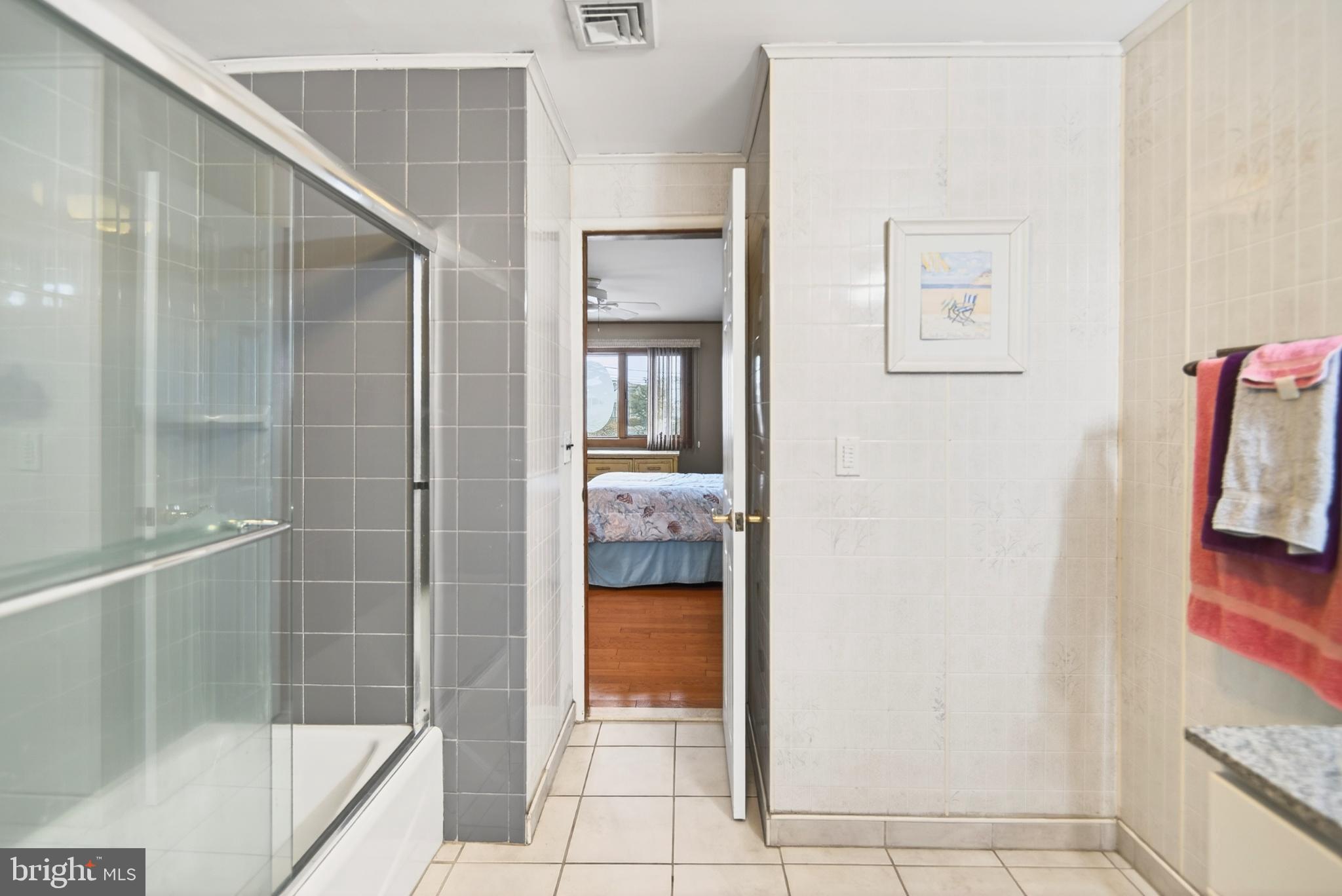 4 Rona Lane Manahawkin, NJ 08050 - Photo 27 of 28 Modern bathroom with serene bedroom view.