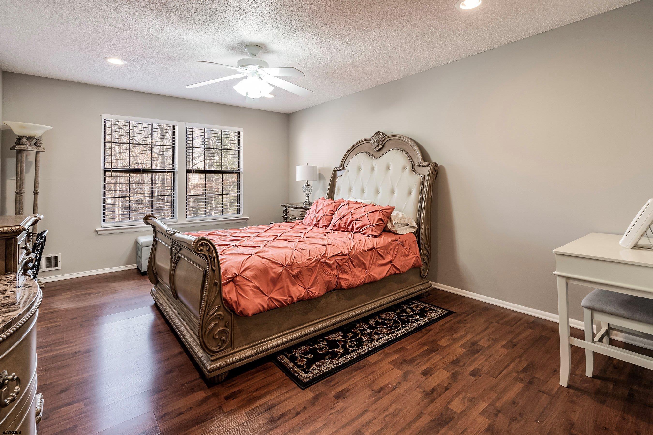 209 Daisy Court, Unit 209 Jackson, NJ 08527 - Photo 13 of 26 a bed sitting in a bedroom next to a window