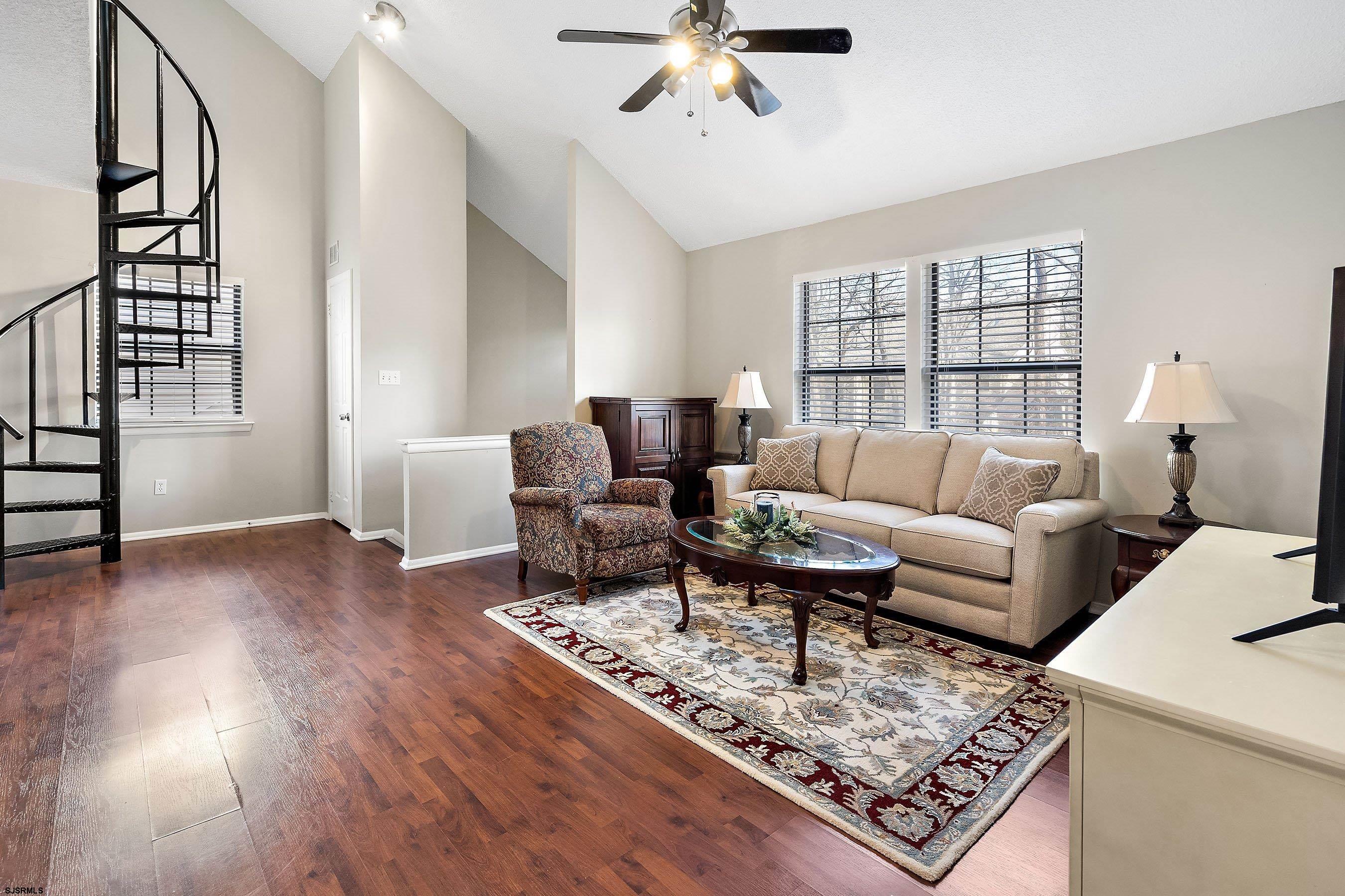 209 Daisy Court, Unit 209 Jackson, NJ 08527 - Photo 2 of 26 a living room with furniture and wooden floor