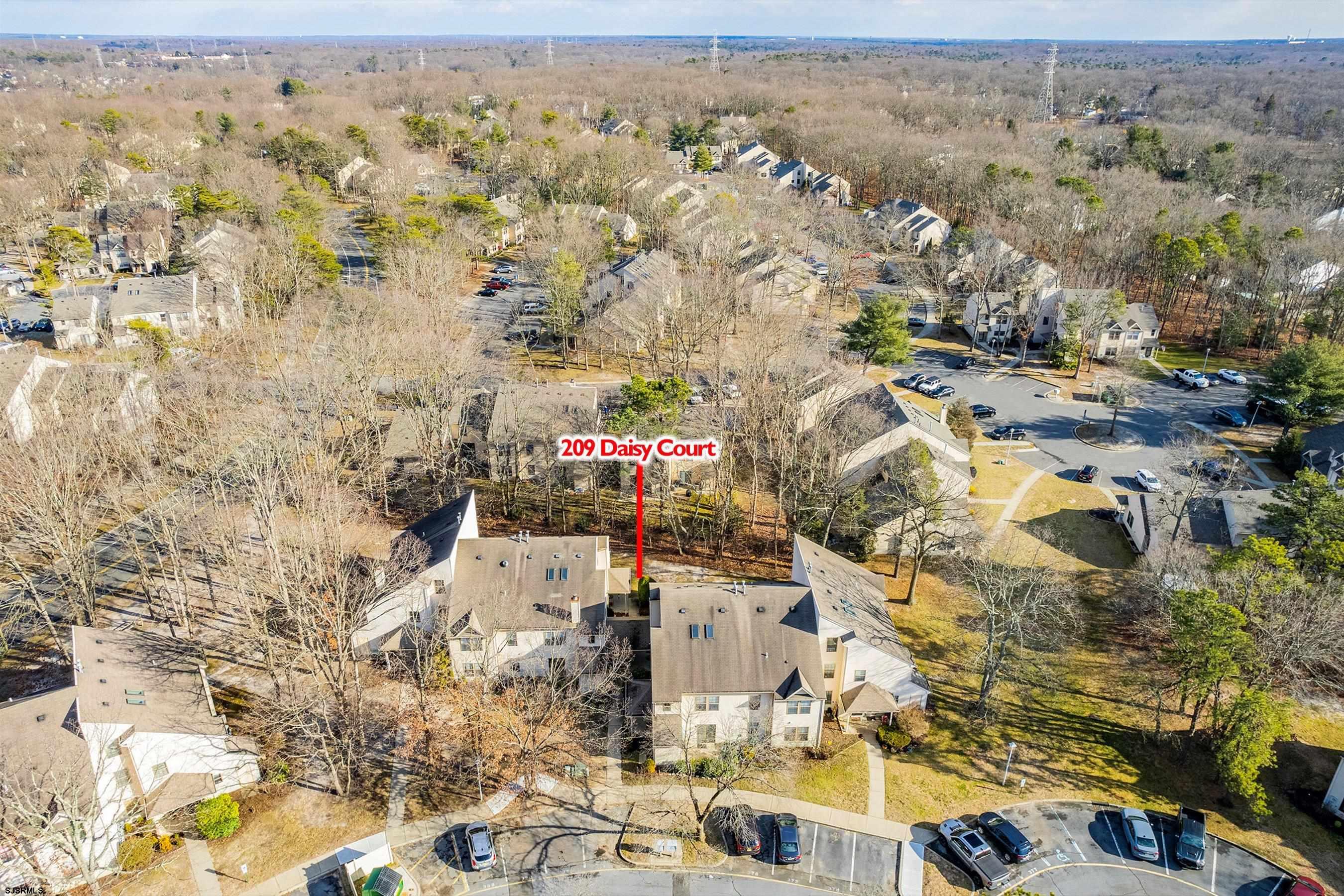 209 Daisy Court, Unit 209 Jackson, NJ 08527 - Photo 25 of 26 an aerial view of residential houses with outdoor space