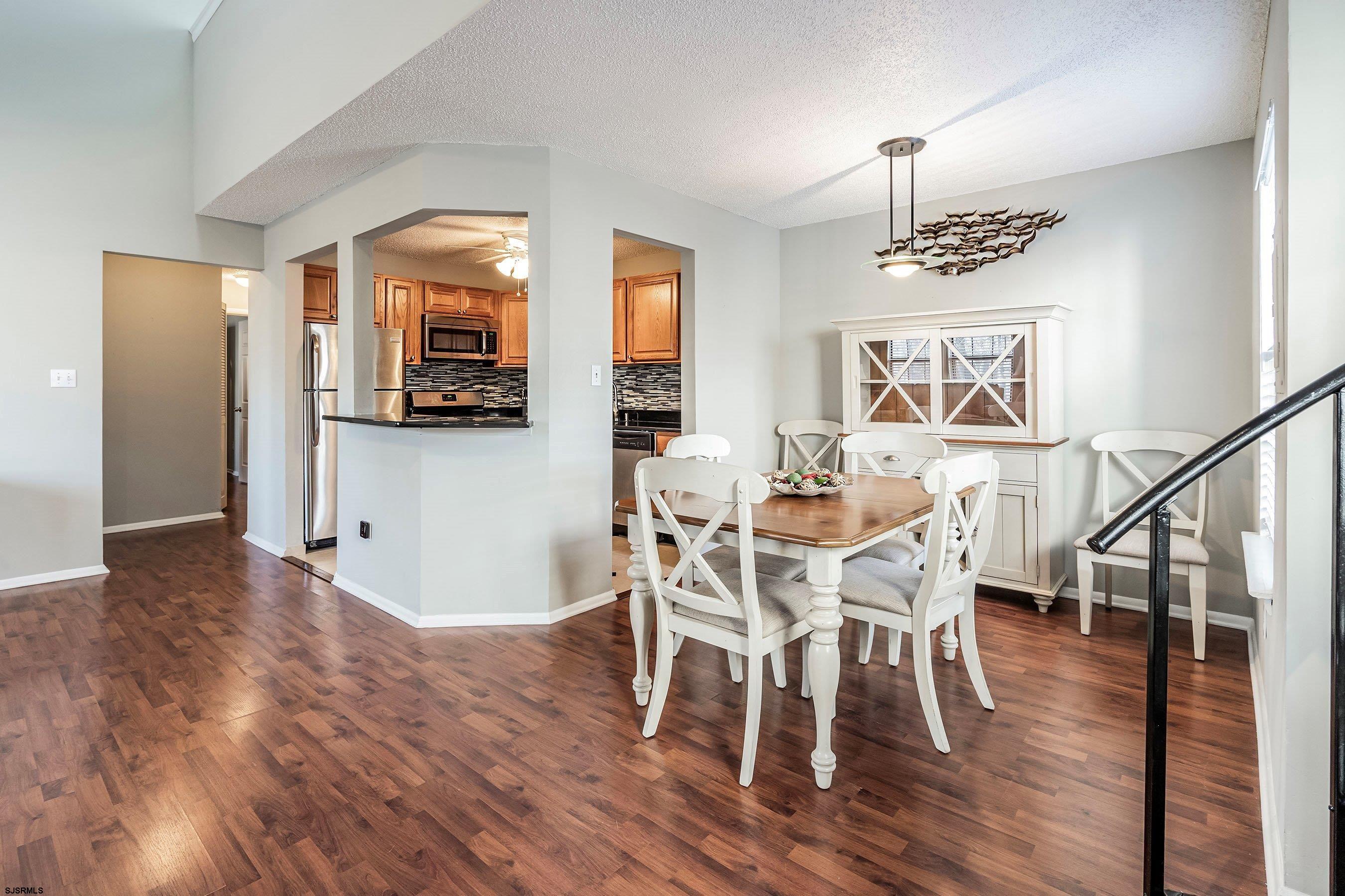 209 Daisy Court, Unit 209 Jackson, NJ 08527 - Photo 7 of 26 a view of a dining room with furniture and wooden floor