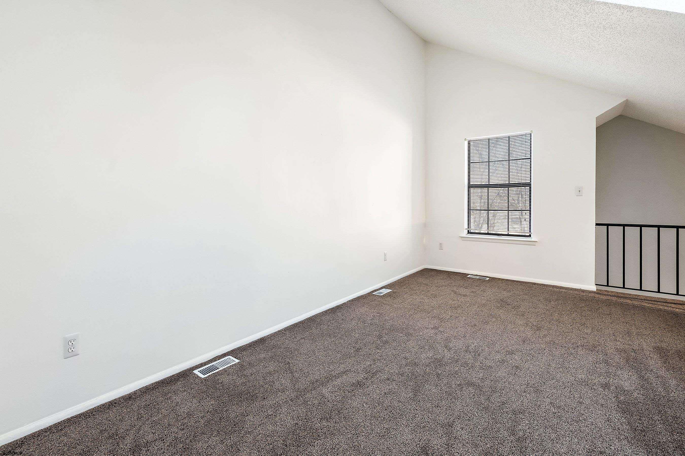 209 Daisy Court, Unit 209 Jackson, NJ 08527 - Photo 10 of 26 an empty room with windows