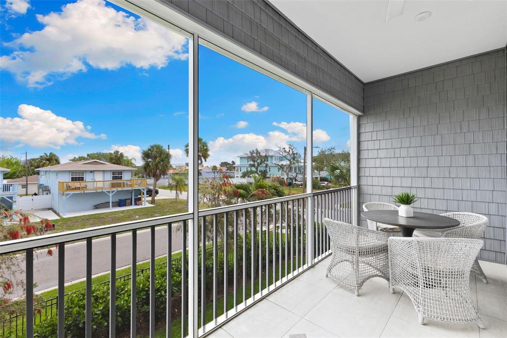 2503 Coral Court Indian Rocks Beach, FL 33785 - Photo 18 of 42 a view of a chairs and table in patio