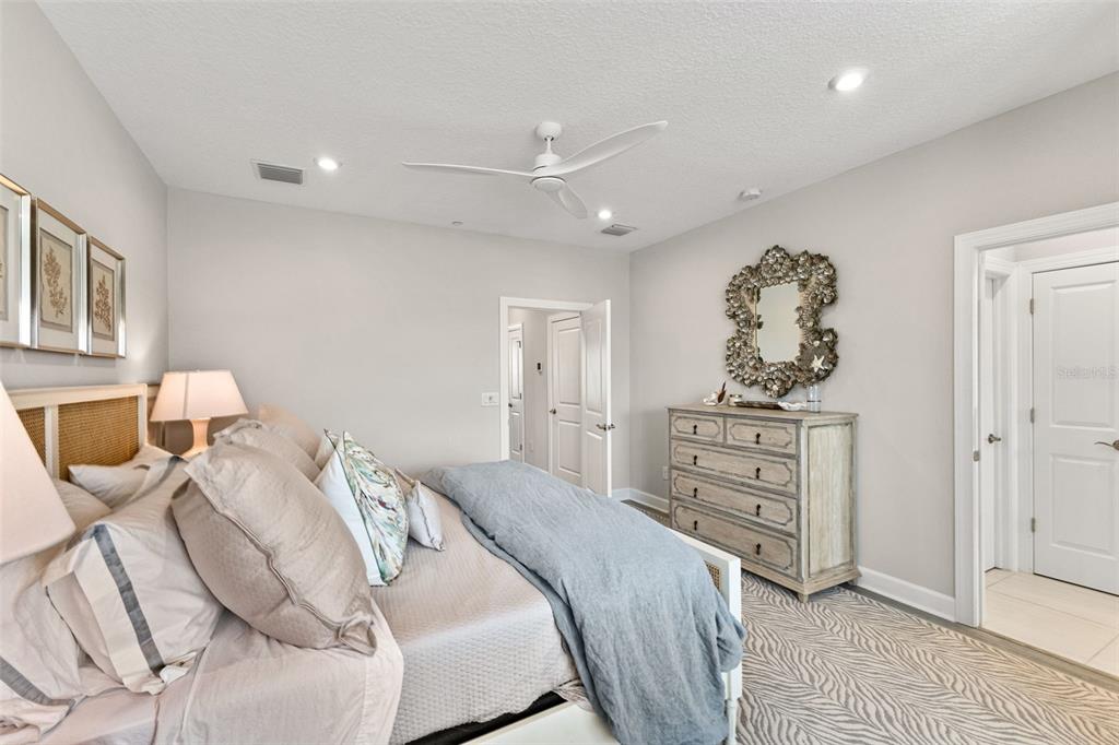 2503 Coral Court Indian Rocks Beach, FL 33785 - Photo 23 of 42 a bedroom with a bed and a dresser