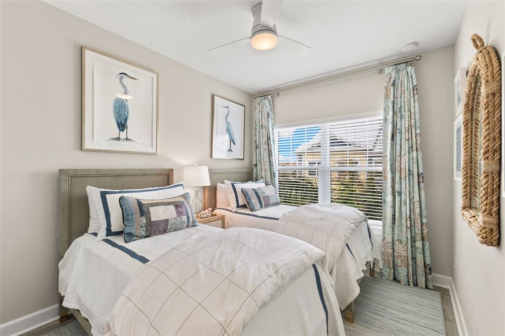 2503 Coral Court Indian Rocks Beach, FL 33785 - Photo 27 of 42 a bedroom with a large bed and a window