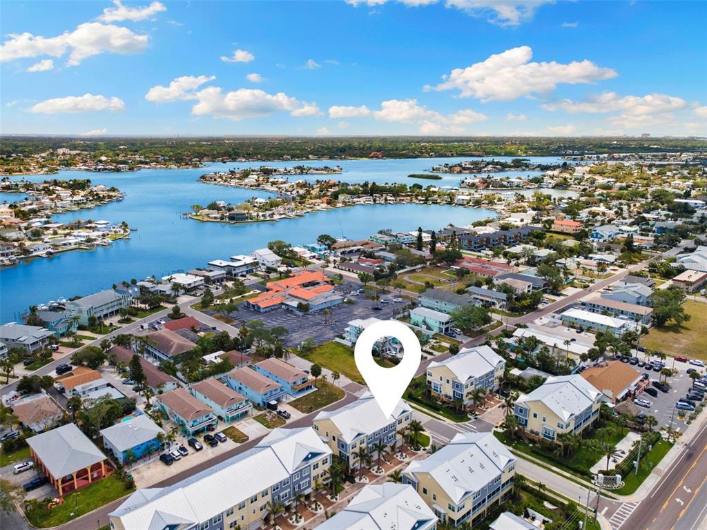 2503 Coral Court Indian Rocks Beach, FL 33785 - Photo 39 of 42 an aerial view of a city with lots of residential buildings and ocean view in back