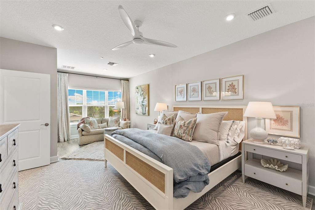2503 Coral Court Indian Rocks Beach, FL 33785 - Photo 4 of 42 a large bedroom with a bed and a large window