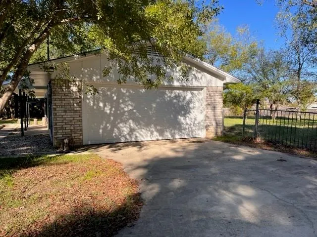 a backyard of a house with wooden fence