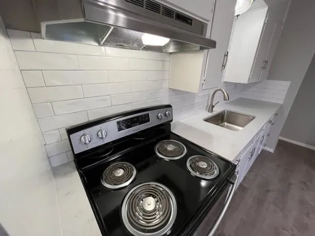 a close view of stove sitting inside of a kitchen