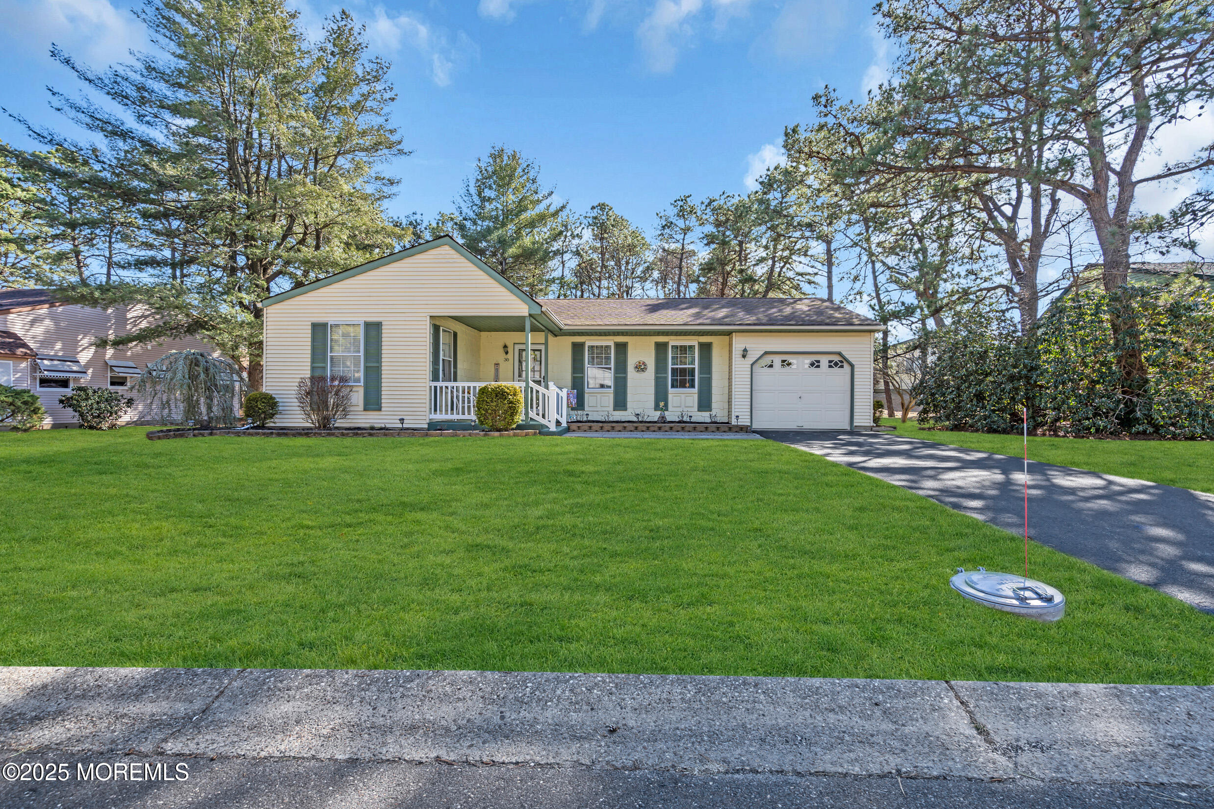 30 Sunset Road Whiting, NJ 08759 - Photo 29 of 31 a front view of house with yard and green space