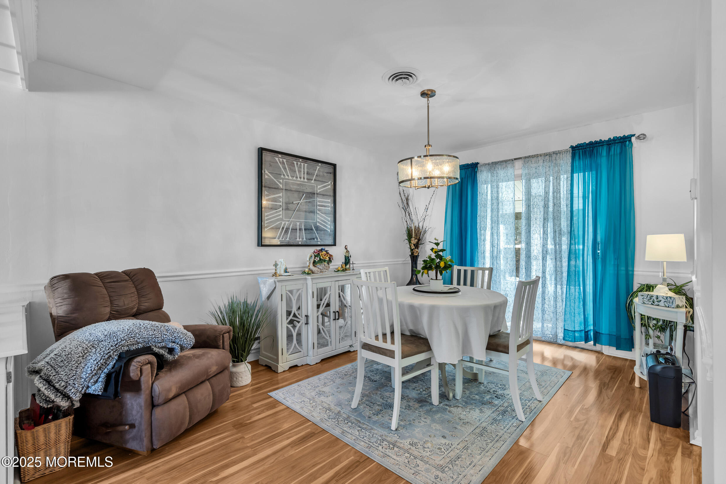 30 Sunset Road Whiting, NJ 08759 - Photo 6 of 31 a living room with furniture and a chandelier