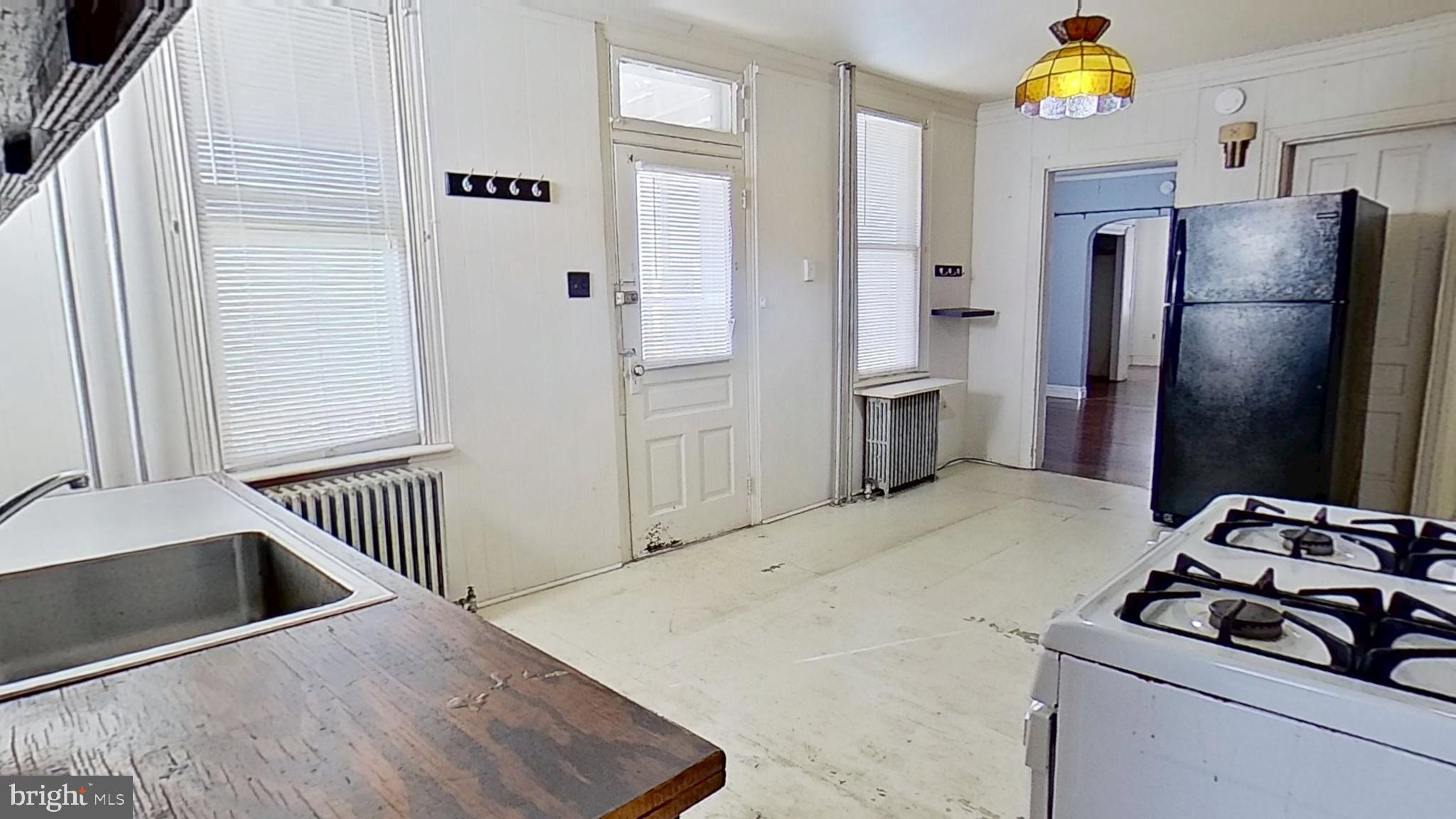 1336 West Philadelphia Street York, PA 17404 - Photo 2 of 5 a kitchen with stainless steel appliances granite countertop a refrigerator and a sink