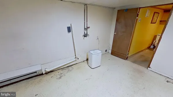 a view of a storage & utility room with a sink