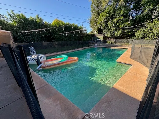 a view of a backyard with a lake view
