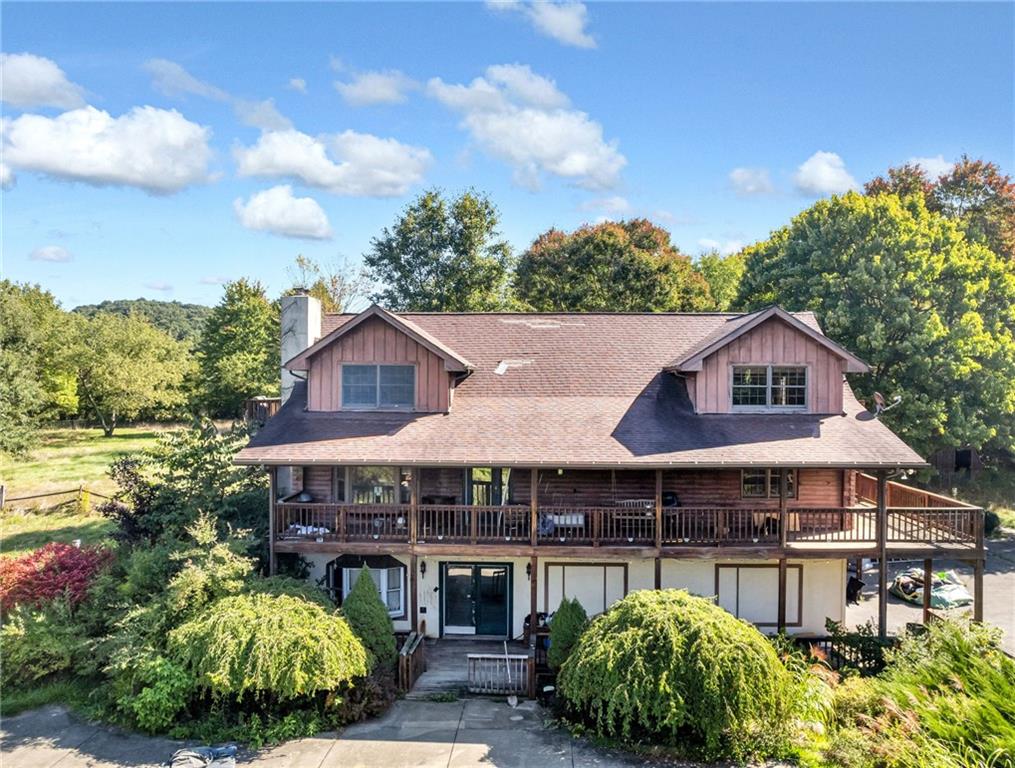 145 Snyder Drive Rochester, PA 15074 - Photo 29 of 37 a front view of a house with garden