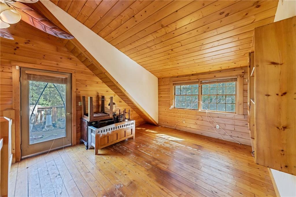145 Snyder Drive Rochester, PA 15074 - Photo 34 of 37 a view of front door with wooden floor and stairs