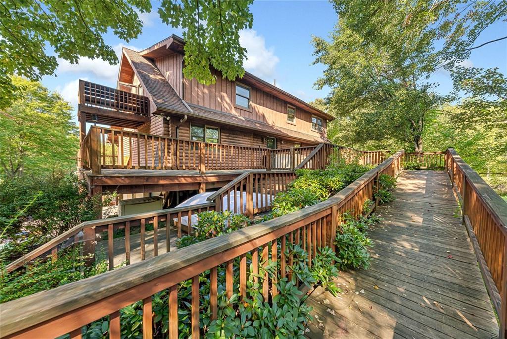 145 Snyder Drive Rochester, PA 15074 - Photo 4 of 37 a balcony view with couple of trees and wooden fence