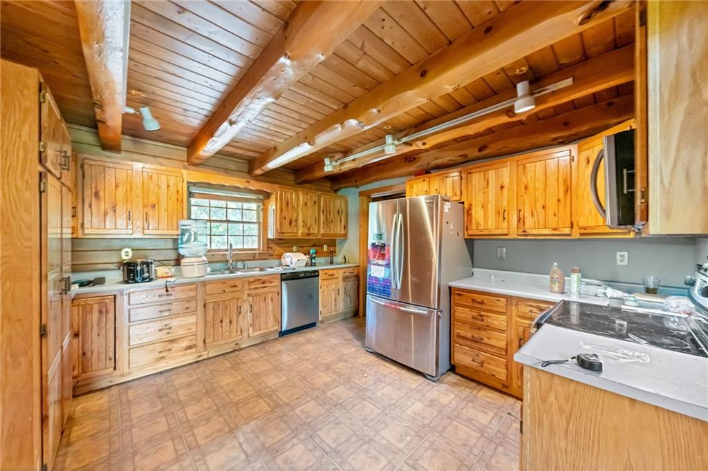 145 Snyder Drive Rochester, PA 15074 - Photo 8 of 37 a kitchen with stainless steel appliances granite countertop a sink and cabinets
