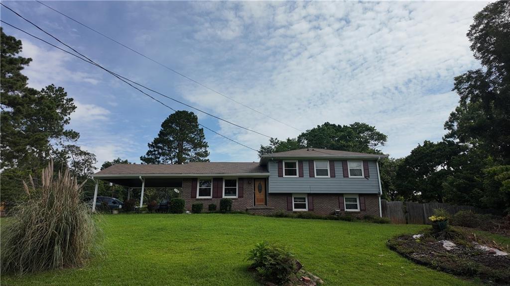 a view of a house with garden and yard