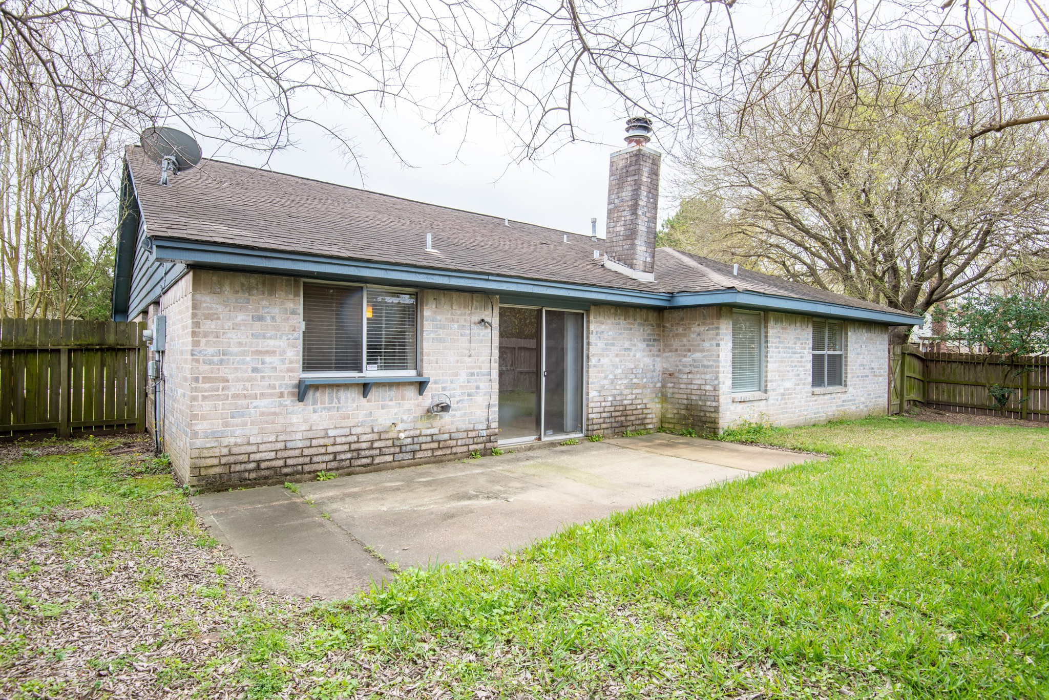 12034 Paddock Way Houston, TX 77065 - Photo 18 of 19 Back patio is a perfect spot for a grille or potted plants.
