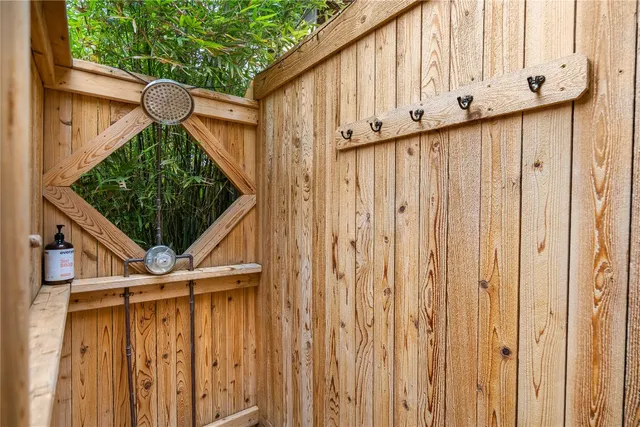a backyard of a house with lots of green space and a fountain