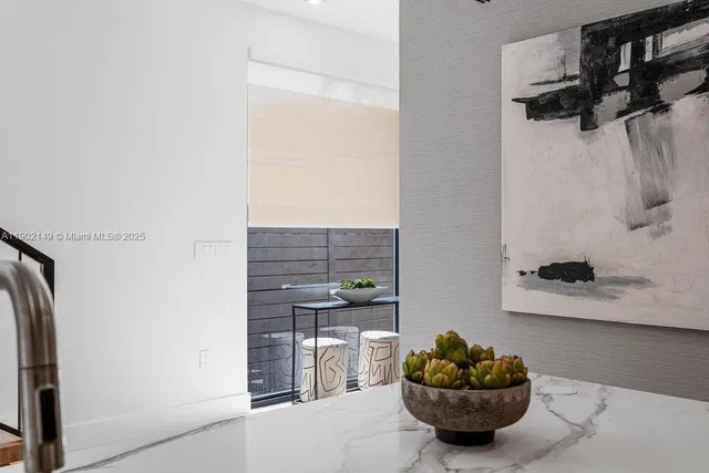 a living room with furniture a flat screen tv and a large window