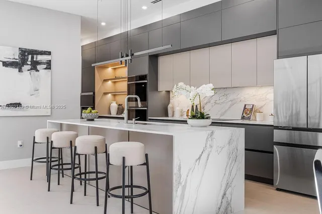 a view of a dining room with furniture wooden floor and a chandelier