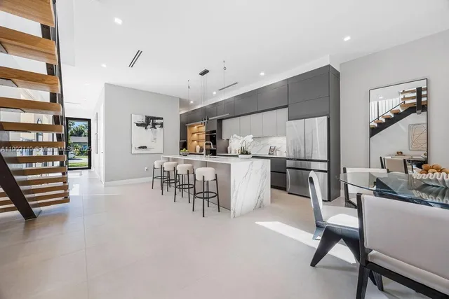 a view of a livingroom with furniture and a piano