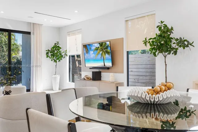 a view of staircase with lots of frames on wall and a view of a stairs