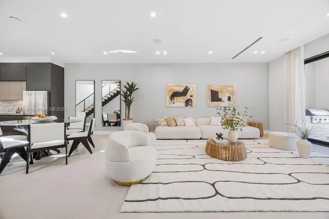 a white toilet sitting next to a bathroom sink