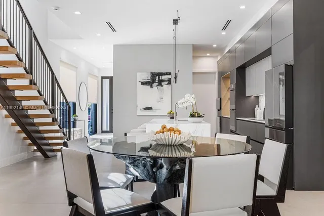 a bathroom with a granite countertop sink a toilet and shower