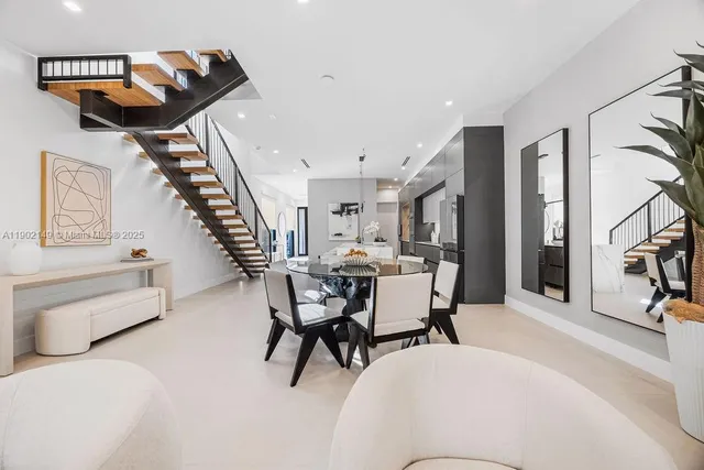 a white toilet sitting next to a bathroom sink