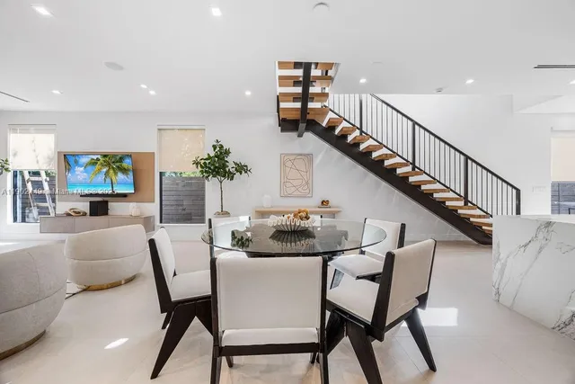 a bathroom with a double vanity sink a mirror and shower