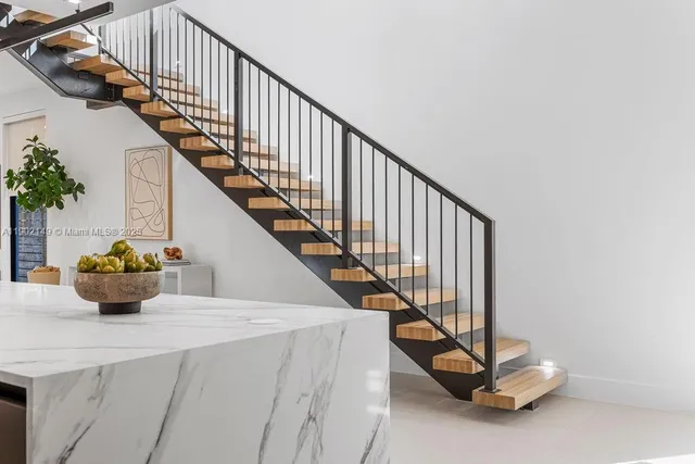 a bathroom with a double vanity sink and mirror with shower