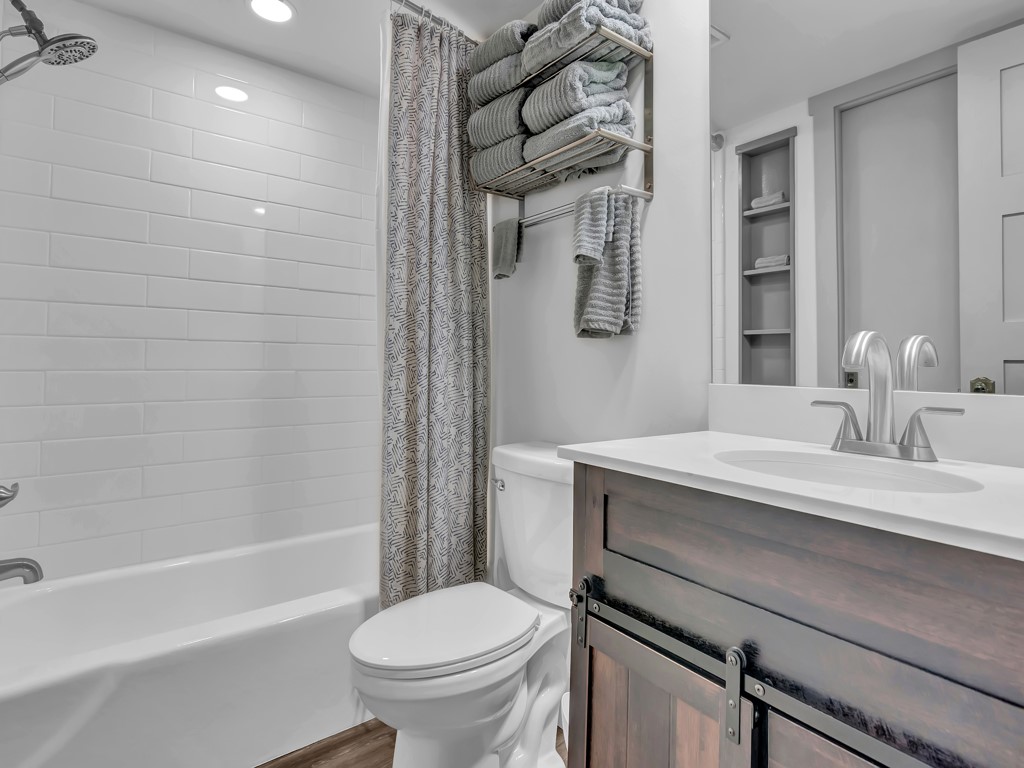 275 Date Palm Road, Unit 304 Vero Beach, FL 32963 - Photo 12 of 36 a bathroom with a sink toilet vanity and shower