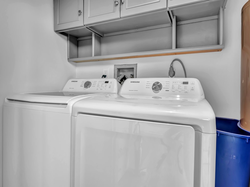 275 Date Palm Road, Unit 304 Vero Beach, FL 32963 - Photo 13 of 36 a utility room with dryer and washer