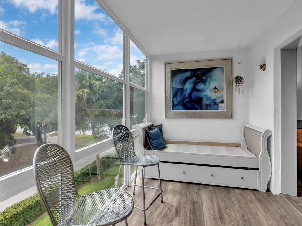 275 Date Palm Road, Unit 304 Vero Beach, FL 32963 - Photo 14 of 36 a living room with furniture and a painting on the wall