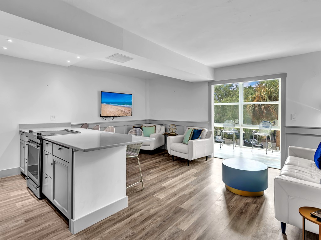 275 Date Palm Road, Unit 304 Vero Beach, FL 32963 - Photo 3 of 36 a living room with furniture and a large window
