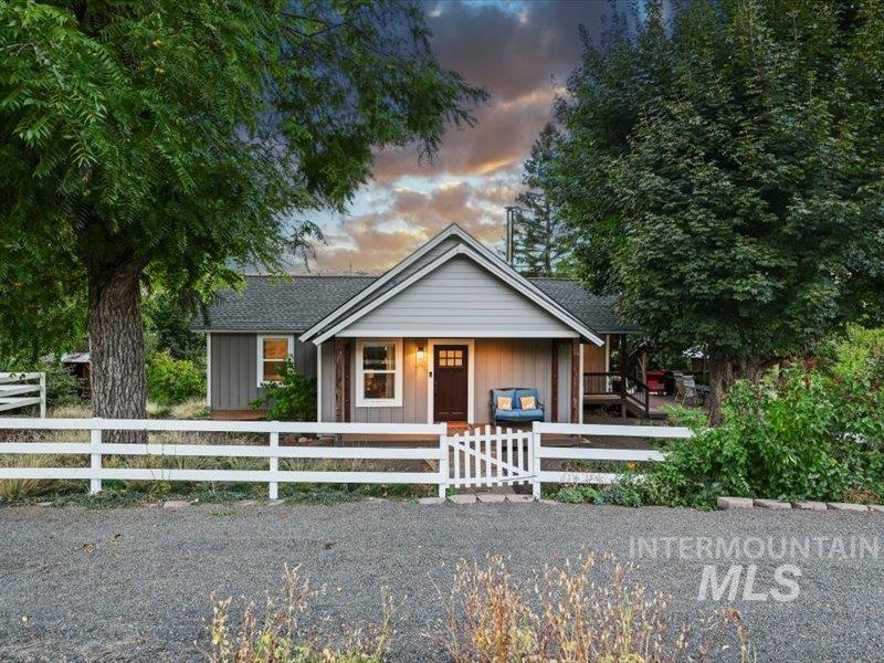 2651 Fruitvale Glendale Road Council, ID 83612 - Photo 24 of 24 Gray-sided residence with white trim and a dark brown front door