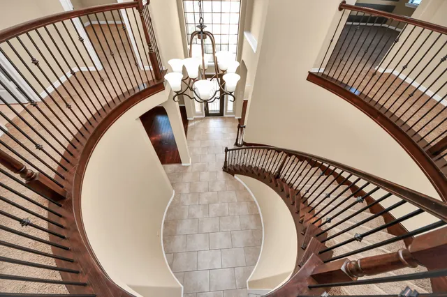 a bathroom with a sink a toilet a mirror and shower