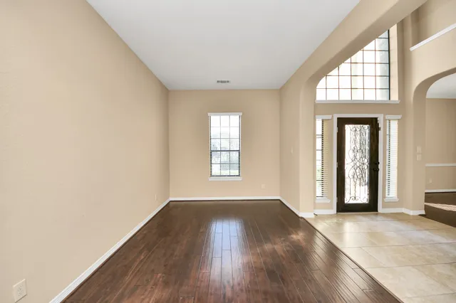a view of an entryway with wooden floor