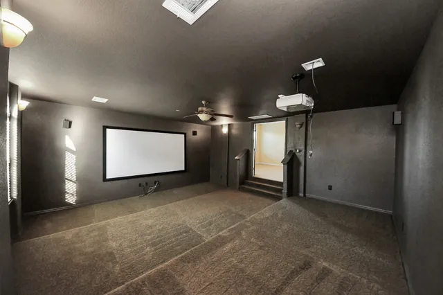 a view of a projector room with projector and screen