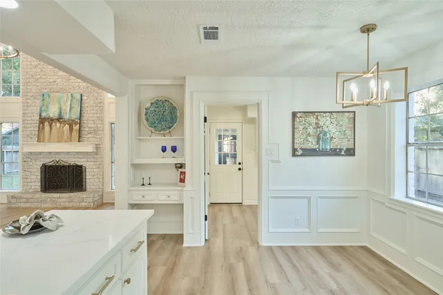 a bathroom with a sink a mirror and a shower