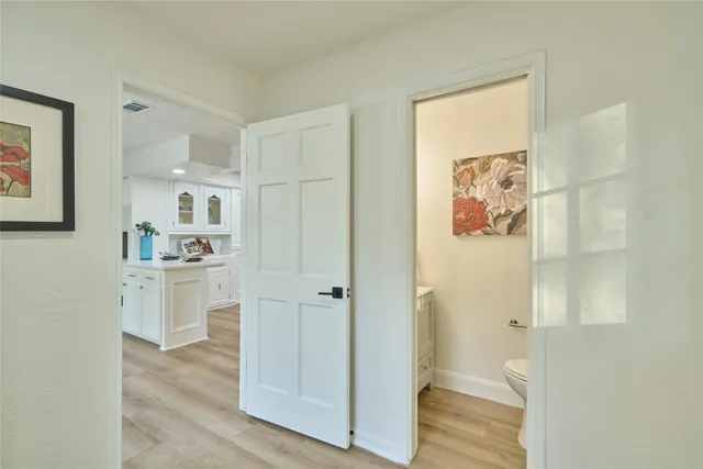a bathroom with a shower and a sink