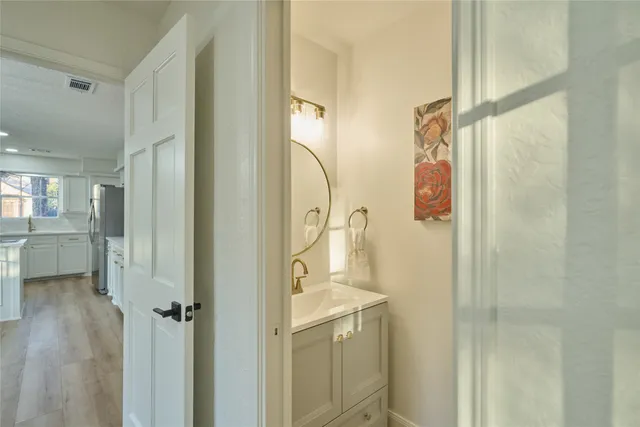 a bathroom with a shower and a sink
