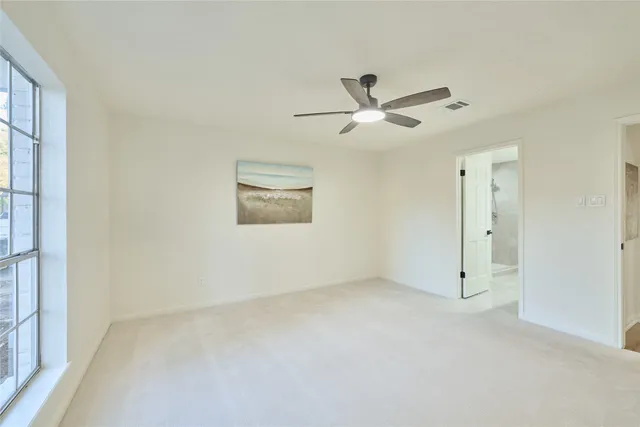 a view of a big room with carpet