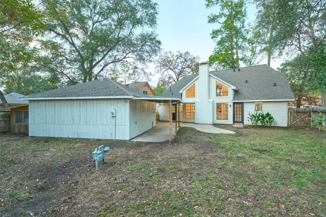 a view of a house with a yard and sitting area