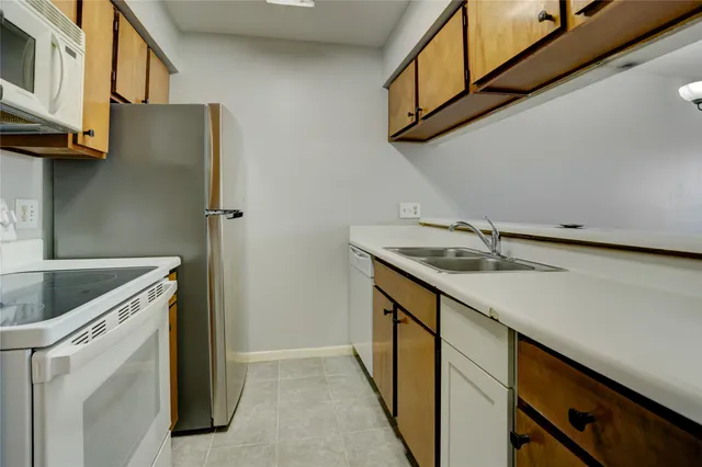 a utility room with a sink a washer and dryer