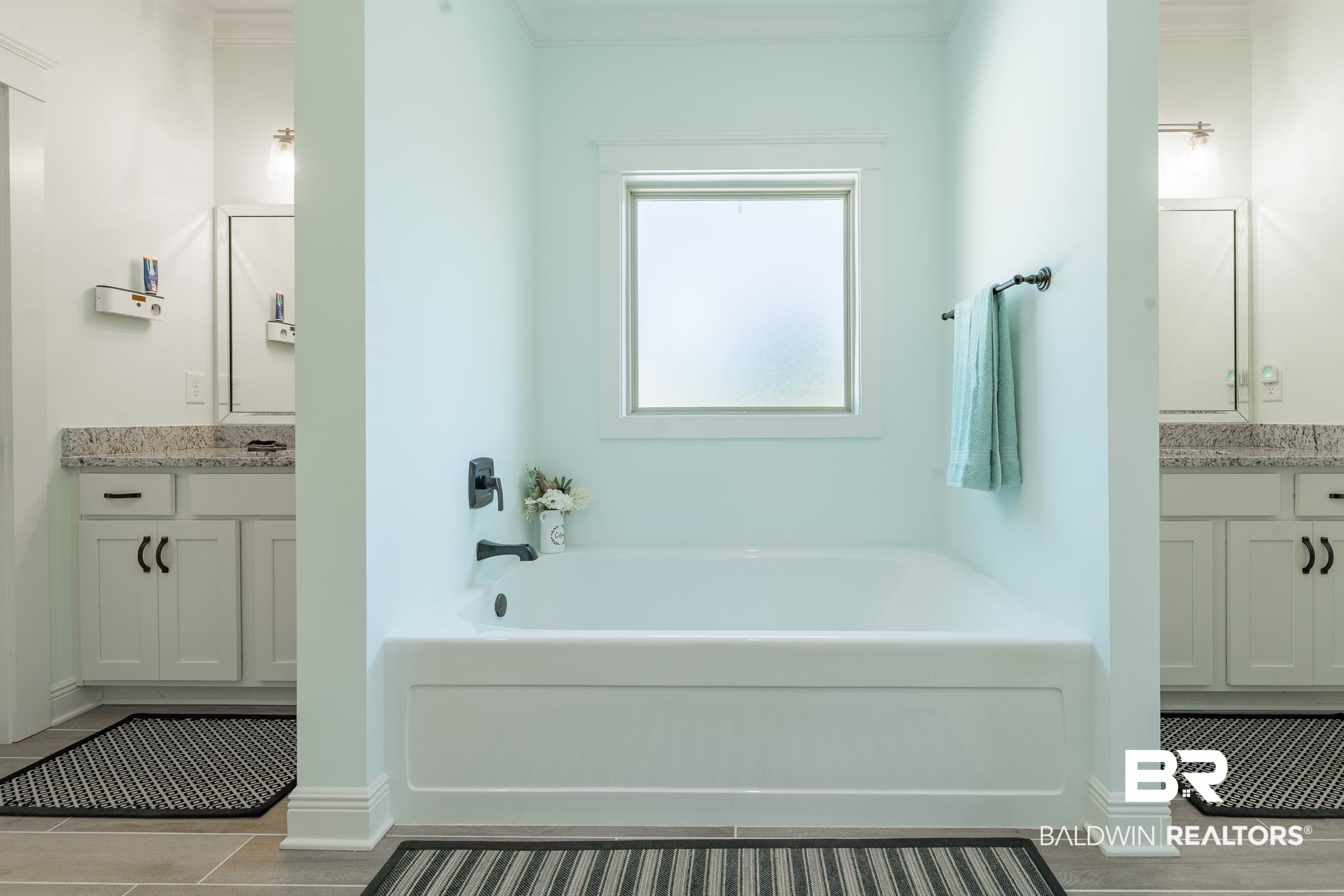 10975 Legacy Lane Mobile, AL 36608 - Photo 22 of 40 Bathroom featuring crown molding, a washtub, and vanity