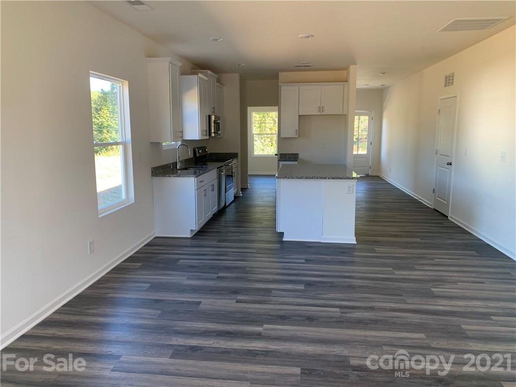 515 3rd Creek Church Road Cleveland, NC 27013 - Photo 3 of 5 a view of kitchen and hall with wooden floor